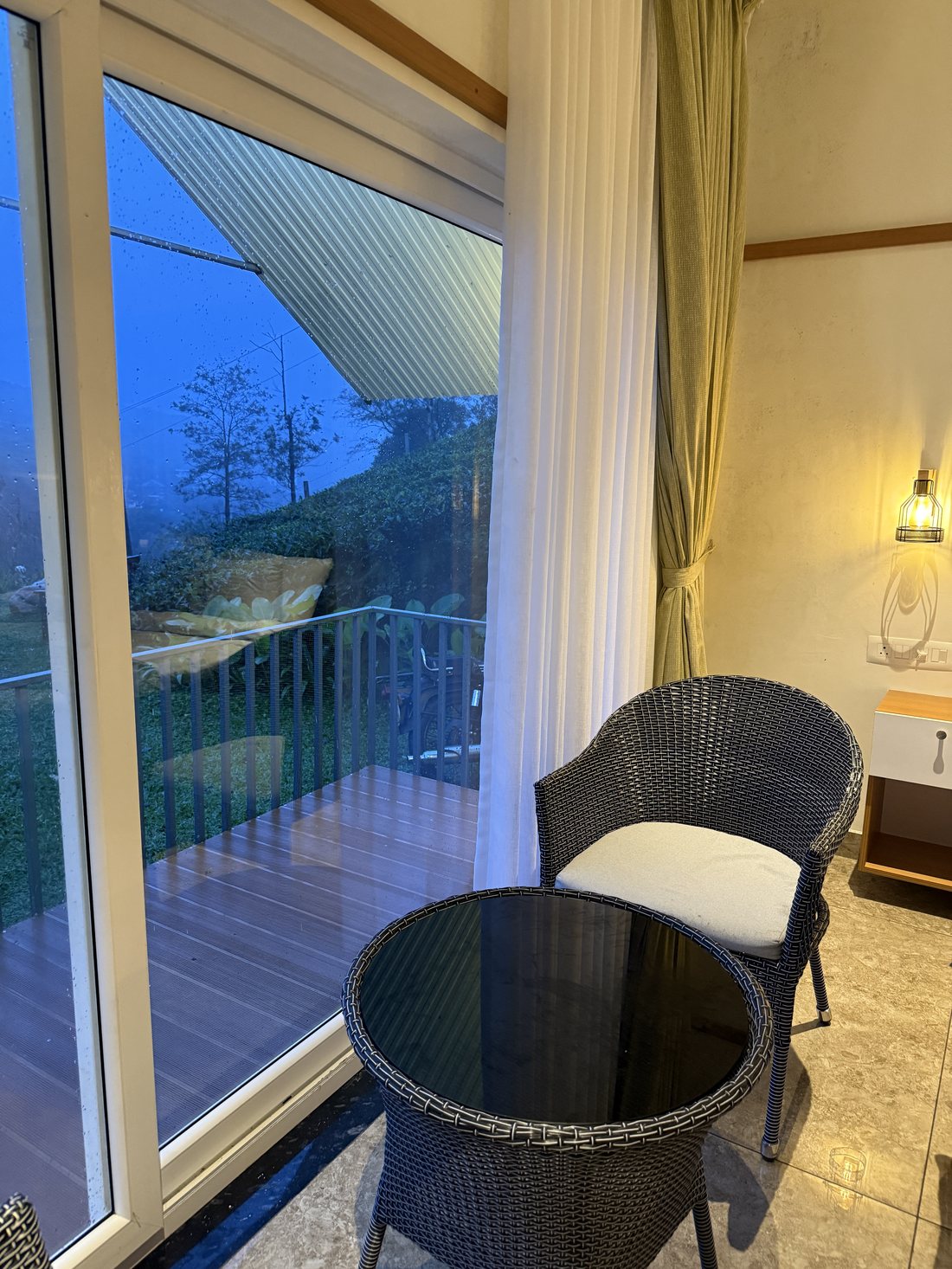 A quiet corner by the balcony window at dusk